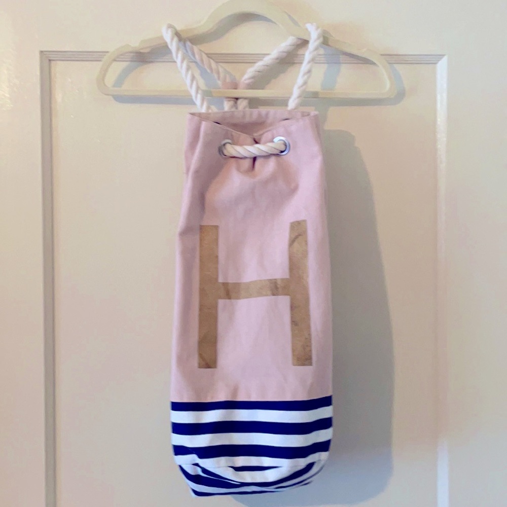 “H” backpack. Makes a great beach bag. NWOT
